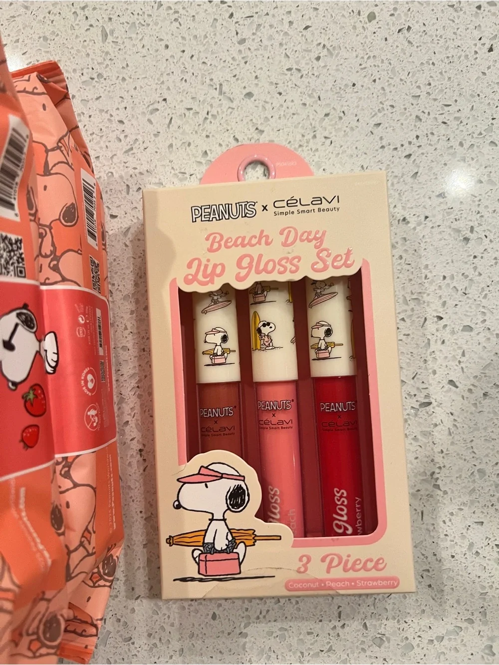 Peanuts x Celavi Berry Glow Cleansing Wipes and lip gloss